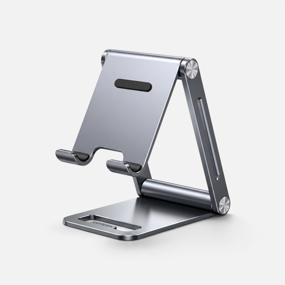 Forsiden av mobil stand, ren produktvisning. Silikonflater for å holde mobilen på plass.